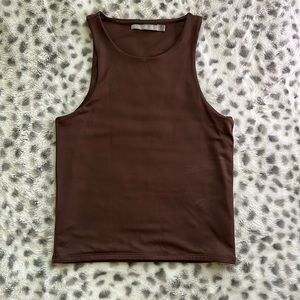 The shirt is from the buckle it is brown size small